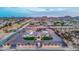 A sprawling desert estate with circular driveway, featuring lush landscaping and picturesque mountain views at 447 W Judd Rd, San Tan Valley, AZ 85143