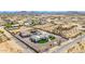 Expansive aerial view of custom home with pool, lush landscaping, and desert surroundings at 447 W Judd Rd, San Tan Valley, AZ 85143