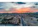 Gorgeous sunset aerial view of a desert landscape, showcasing community and mountain views at 447 W Judd Rd, San Tan Valley, AZ 85143