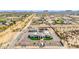 Wide aerial view of a custom home with a long driveway and a surrounding desert landscape at 447 W Judd Rd, San Tan Valley, AZ 85143