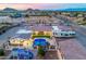 Aerial view of a desert home with a sparkling pool, outdoor kitchen, playground, and RV parking area at 447 W Judd Rd, San Tan Valley, AZ 85143