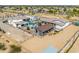 Expansive desert estate with a custom home, guesthouse, playground, pool and barn with horse area at 447 W Judd Rd, San Tan Valley, AZ 85143