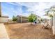Fenced backyard with playground and mature trees at 447 W Judd Rd, San Tan Valley, AZ 85143