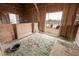 A horse barn offers stalls with metal grate dividers and a dirt floor covered in hay at 447 W Judd Rd, San Tan Valley, AZ 85143