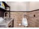 Unique bathroom with utility sink, urinal, and wood-look paneled walls at 447 W Judd Rd, San Tan Valley, AZ 85143