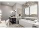 Beautiful bathroom with a luxurious soaking tub, vanity area, and elegant decor at 447 W Judd Rd, San Tan Valley, AZ 85143