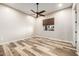 Bedroom featuring wood-look flooring, modern ceiling fan, and window with blinds at 447 W Judd Rd, San Tan Valley, AZ 85143