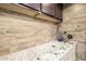 Convenient dog wash station with detailed tile work and a handheld sprayer for easy pet grooming at 447 W Judd Rd, San Tan Valley, AZ 85143