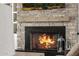 Close-up of the stone fireplace with a wooden mantle and decorative accessories at 447 W Judd Rd, San Tan Valley, AZ 85143
