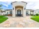 Inviting front entrance featuring a stone walkway, arched entry, and seating area at 447 W Judd Rd, San Tan Valley, AZ 85143