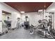 Well-equipped home gym with various workout machines, weights, and mirrored walls at 447 W Judd Rd, San Tan Valley, AZ 85143