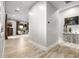 Hallway with wood-style flooring and art niche that leads to the living room and outdoor patio at 447 W Judd Rd, San Tan Valley, AZ 85143
