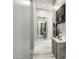 Hallway features marble floors, accent table with decor, and a mirror reflecting the spacious interior at 447 W Judd Rd, San Tan Valley, AZ 85143