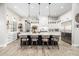 Open kitchen with a large center island, modern lighting, and bar stool seating at 447 W Judd Rd, San Tan Valley, AZ 85143