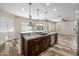 Spacious kitchen with stainless steel appliances, an island with bar seating, and an open layout at 447 W Judd Rd, San Tan Valley, AZ 85143