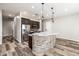 Open-concept kitchen with stainless steel appliances, a large island, and a breakfast bar for casual dining at 447 W Judd Rd, San Tan Valley, AZ 85143