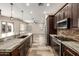 Spacious kitchen with stainless steel appliances, an island with bar seating, and an open layout at 447 W Judd Rd, San Tan Valley, AZ 85143