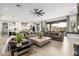 Expansive living area showcasing an open layout with a kitchen, dining, and living room at 447 W Judd Rd, San Tan Valley, AZ 85143