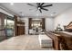 Spacious main bedroom with an outdoor view and access, hardwood floors, and a comfortable seating area at 447 W Judd Rd, San Tan Valley, AZ 85143