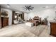 Spacious main bedroom with a ceiling fan, and neutral decor with natural light from a large window at 447 W Judd Rd, San Tan Valley, AZ 85143