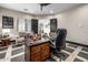 Home office featuring custom wood desk, modern flooring, and neutral tones with ample natural light at 447 W Judd Rd, San Tan Valley, AZ 85143