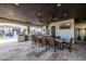Inviting outdoor kitchen and dining area, perfect for entertaining with ceiling fans to provide a cool breeze at 447 W Judd Rd, San Tan Valley, AZ 85143