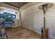Covered patio with decorative concrete flooring features an outdoor heater and a storage rack at 447 W Judd Rd, San Tan Valley, AZ 85143