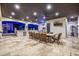 A covered patio is perfect for outdoor entertaining with its outdoor kitchen and dining area at 447 W Judd Rd, San Tan Valley, AZ 85143