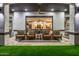 A covered outdoor living space features outdoor seating and open view to the indoor living space at 447 W Judd Rd, San Tan Valley, AZ 85143