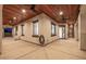 Spacious outdoor patio with ceiling fans, offering ample space for relaxation and entertaining at 447 W Judd Rd, San Tan Valley, AZ 85143