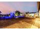 Backyard playground with a play structure and lush landscaping at 447 W Judd Rd, San Tan Valley, AZ 85143