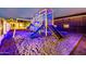 playground with a modern play structure, complete with a slide, climbing wall and swings at 447 W Judd Rd, San Tan Valley, AZ 85143