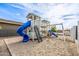 Neighborhood playground with slide, swings, and climbing structure at 447 W Judd Rd, San Tan Valley, AZ 85143