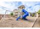 Community playground featuring a large slide and swings at 447 W Judd Rd, San Tan Valley, AZ 85143