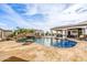 Backyard pool with a stone waterfall feature, perfect for relaxation at 447 W Judd Rd, San Tan Valley, AZ 85143