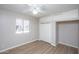 Spacious bedroom with light walls, ceiling fan, and closet with sliding doors at 4502 E Carol Ave # 1, Mesa, AZ 85206