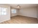 Bright and spacious bedroom featuring wood-look floors and a ceiling fan at 4502 E Carol Ave # 1, Mesa, AZ 85206