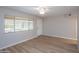 Bright living room with vinyl floors, neutral walls, and a ceiling fan at 4502 E Carol Ave # 1, Mesa, AZ 85206