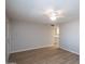 Spacious living room with tile flooring, leading into a modern kitchen at 4502 E Carol Ave # 1, Mesa, AZ 85206