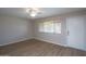 Inviting living room featuring vinyl floors, bright windows, and a ceiling fan at 4502 E Carol Ave # 1, Mesa, AZ 85206