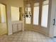 A dining room features tile floors and a chandelier at 4843 E Estevan Rd, Phoenix, AZ 85054