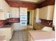 A kitchen is equipped with appliances, cabinets, and light colored countertops at 4843 E Estevan Rd, Phoenix, AZ 85054