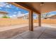 Backyard featuring a patio and yellow brick wall and neutral rock landscaping at 504 E Racine Pl, Casa Grande, AZ 85122