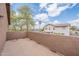 Open air balcony with textured half-wall offers relaxing outdoor living space at 504 E Racine Pl, Casa Grande, AZ 85122