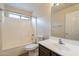 Bathroom featuring a sink, vanity, toilet, and bathtub-shower combination at 504 E Racine Pl, Casa Grande, AZ 85122