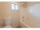 Bathroom featuring a toilet and bathtub with shower at 504 E Racine Pl, Casa Grande, AZ 85122