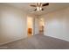 Bedroom with neutral carpet, and ensuite bathroom visible through open doorway at 504 E Racine Pl, Casa Grande, AZ 85122