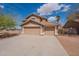 Charming two-story home with a spacious three-car garage and desert landscaping at 504 E Racine Pl, Casa Grande, AZ 85122