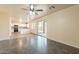 Bright living room featuring tiled flooring, an open-concept layout, and access to kitchen at 504 E Racine Pl, Casa Grande, AZ 85122
