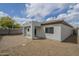 Backyard view showing a covered patio and desert landscaping, perfect for outdoor enjoyment at 507 W Magdalena Ln, Phoenix, AZ 85041